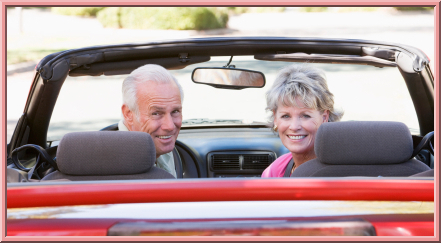Elder couple driving